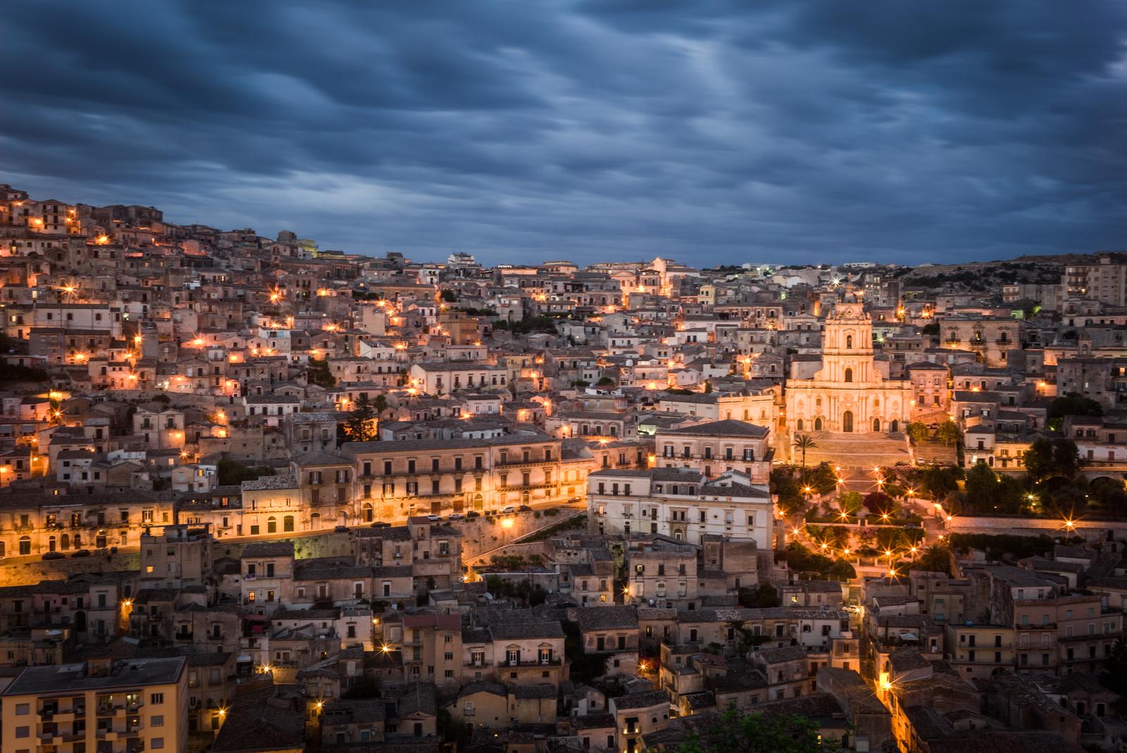 Modica lit up at dusk