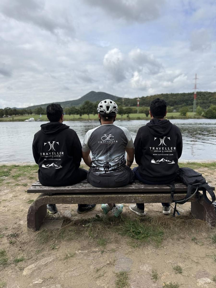 Three riders on a bench looking over the Elbe near Velke Zernoseky